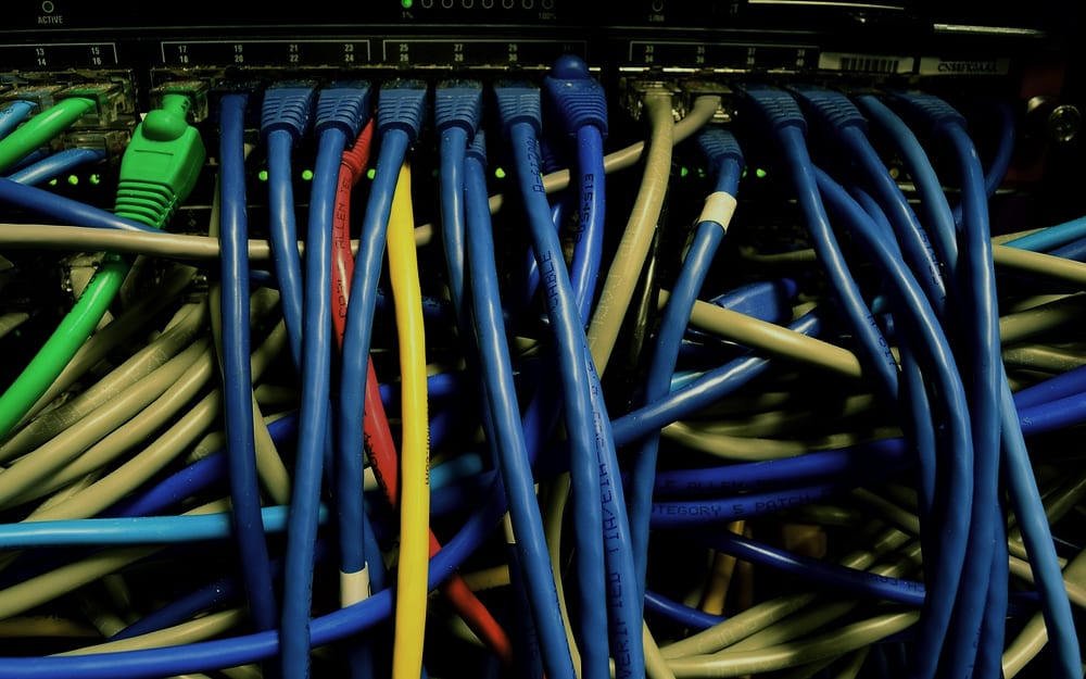 A before shot of dated cabling and hardware ahead of an office refresh