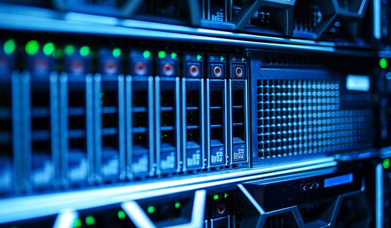 Greenstem technicians building and cabling a network rack on a client site