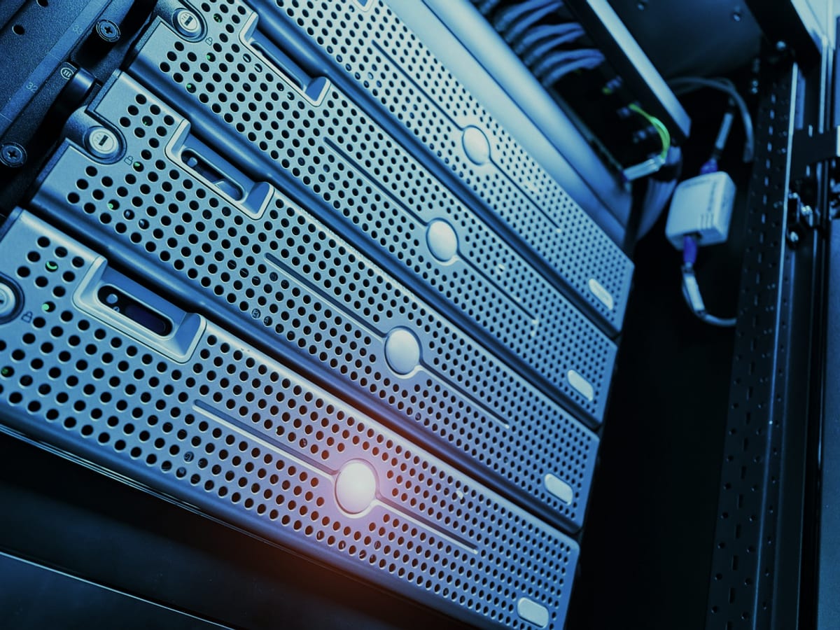A technician configuring a workstation and firewall on site